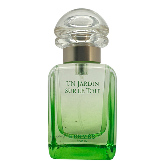 Hermes Un Jardin Sur Le Toit Eau De Toilette Spray 30ml bottle with green accents, representing a fresh rooftop garden-inspired unisex fragrance, available at Zakura Global.